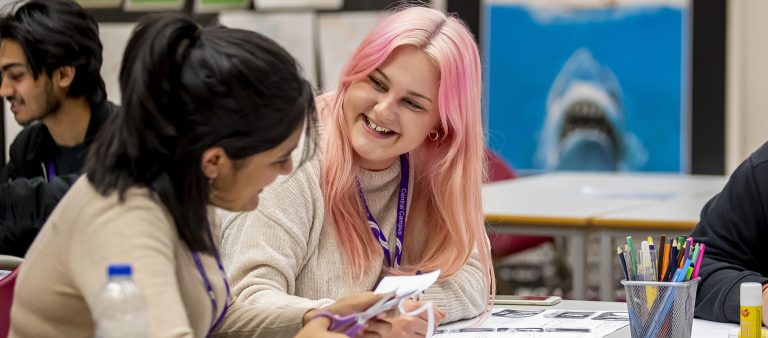 Female Central Saint Michael's Sixth Form students working on a group project