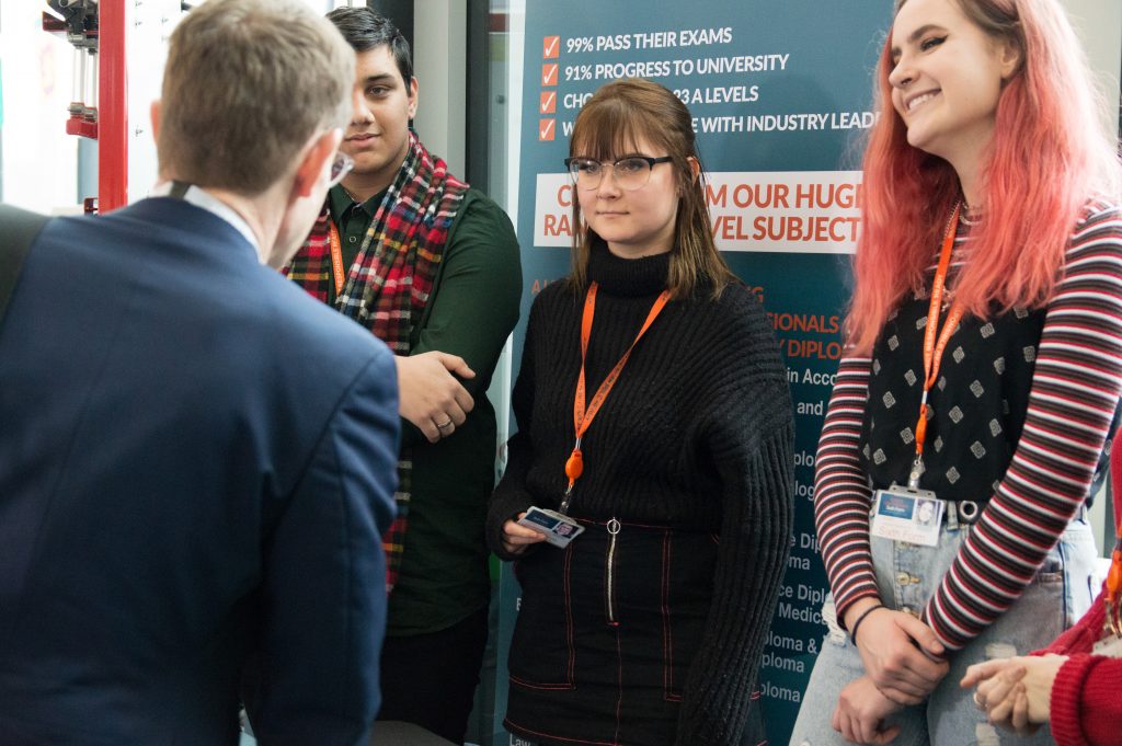 Andy Street meeting a group of male and female Central Saint Michael's Sixth Form students