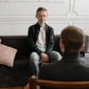 Young male speaking to Psychologist in his office