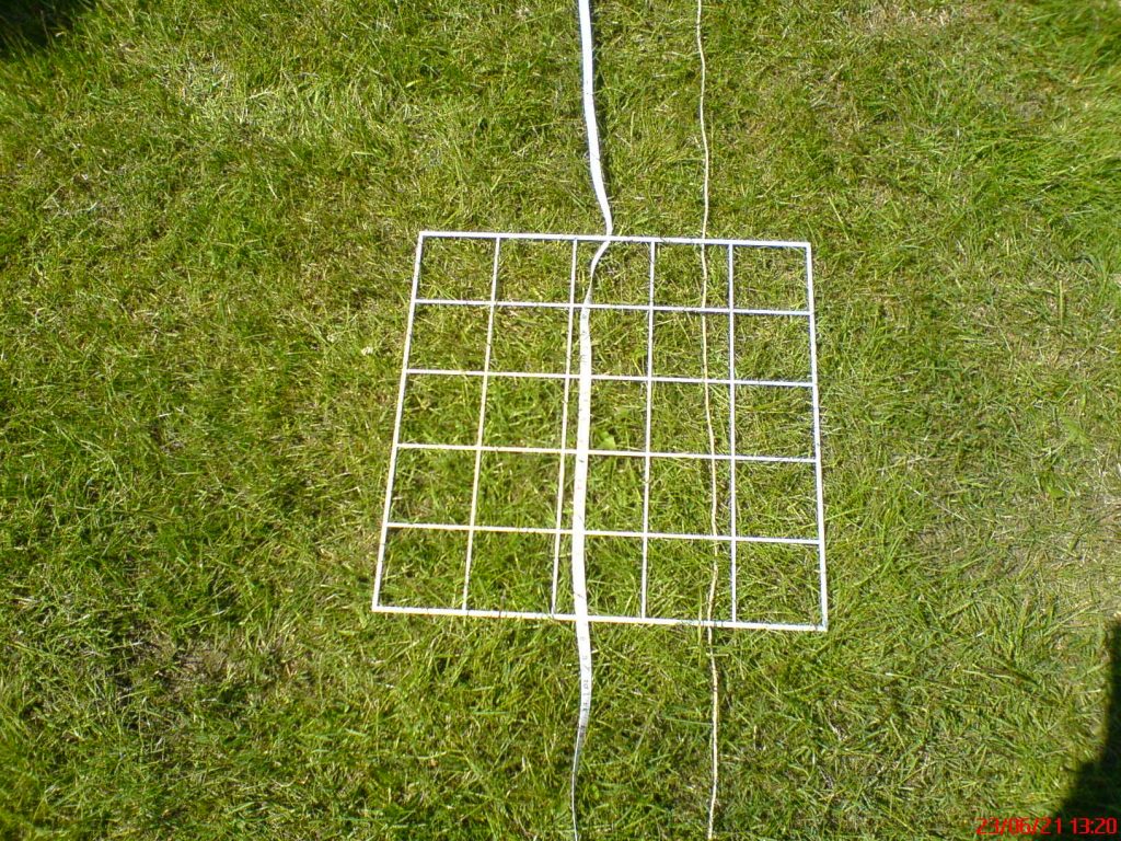 White grid and tape on grass