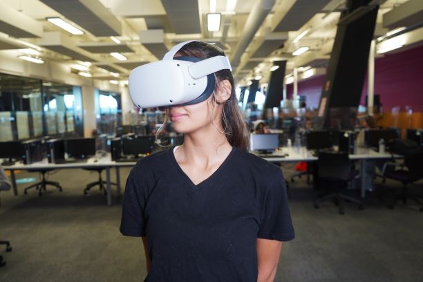 Female student wearing a virtual reality headset