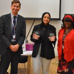Student with two awards presented by two lecturers
