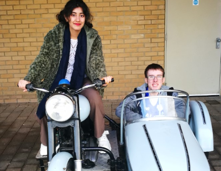 Film students pose in Harry Potter bike and sidecar