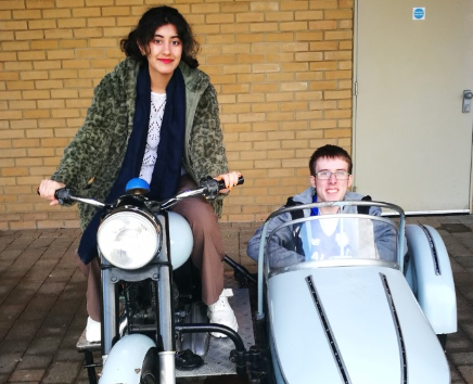 Film students pose in Harry Potter bike and sidecar