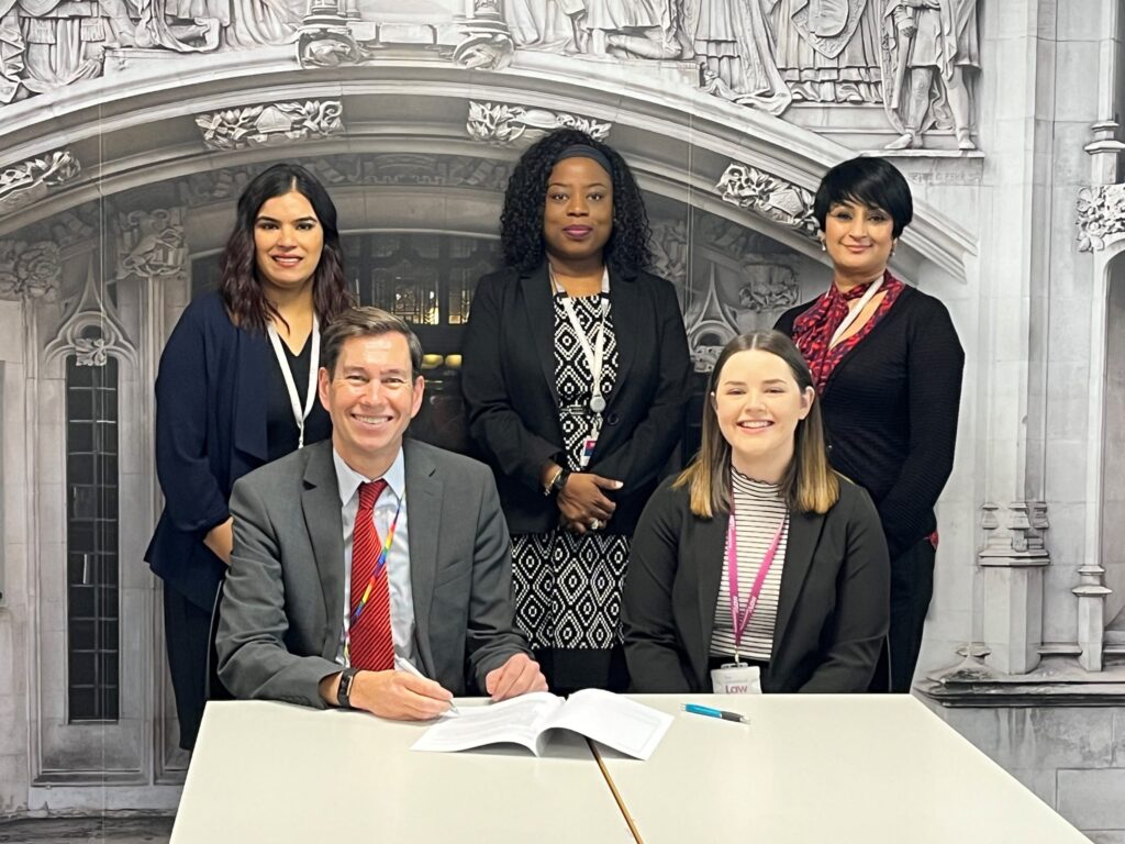 Representatives from Central Saint Michael's and University of Law sign agreement