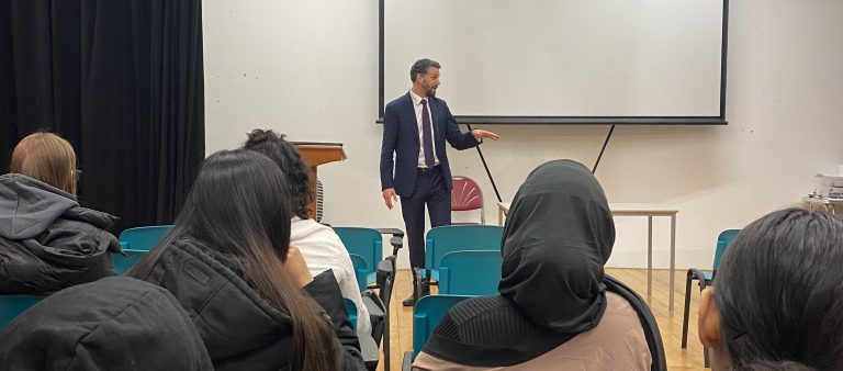 Assistant Police Crime Commissioner Tom O'Neil speaks to students in lecture theatre