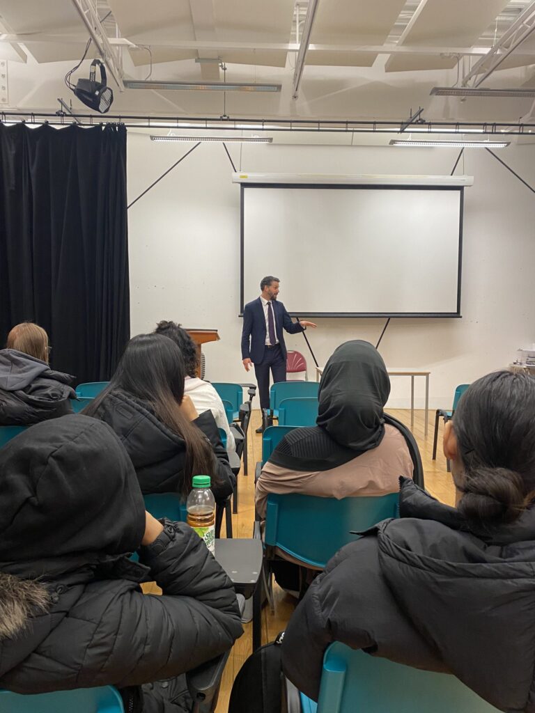 Assistant Police Crime Commissioner Tom O'Neil speaks to students in lecture theatre