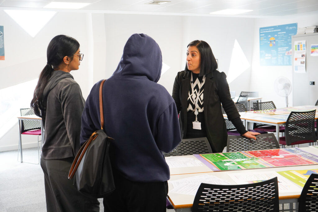 Parent and student talking to student