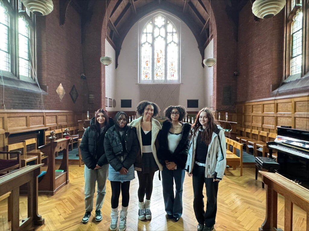 Five female students in the Cambridge University hall