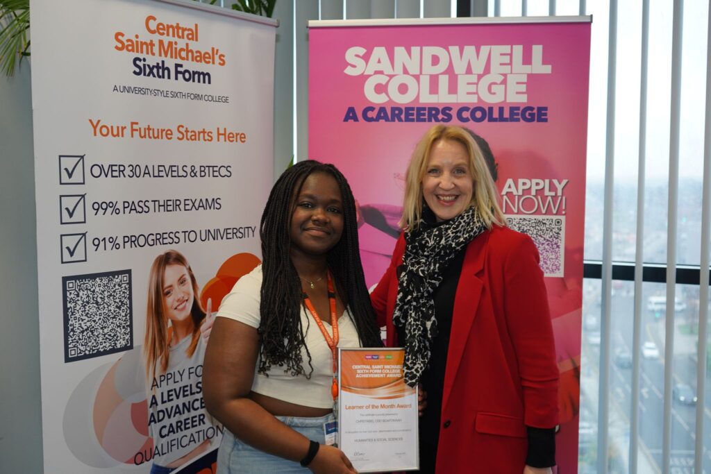 Female student presented with certificate by female MP