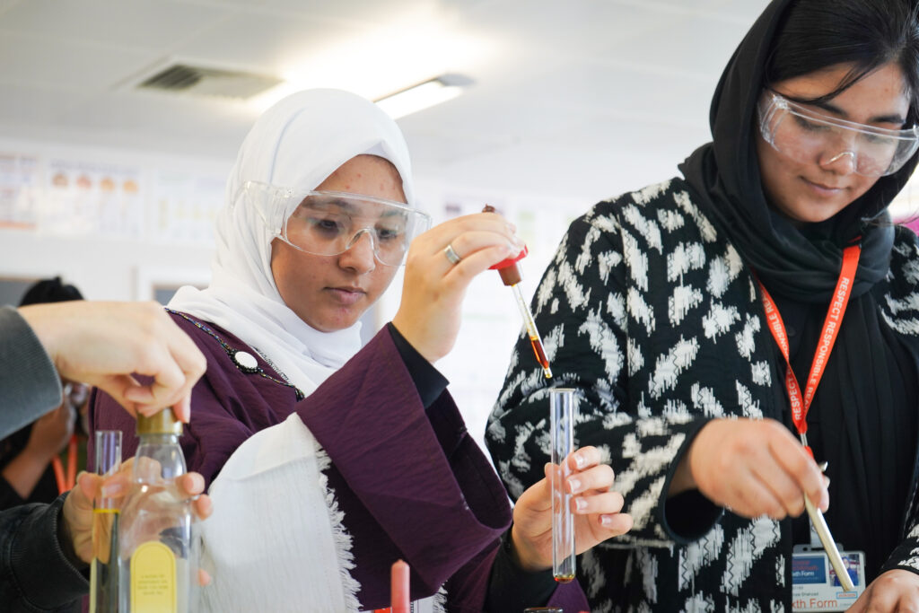 Student with science experiment