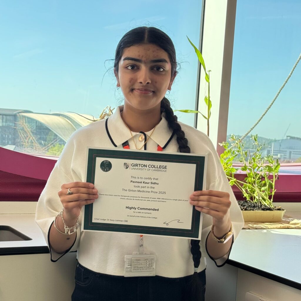 Student smiling with her certificate