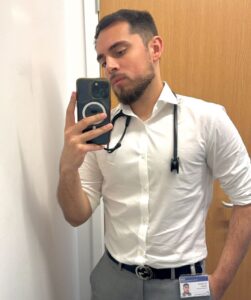 Former student Sameer taking selfie wearing stethoscope