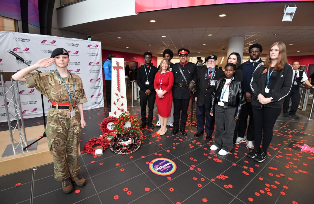Staff and army cadet student gather at the cenotaph with Deputy Lieutenant