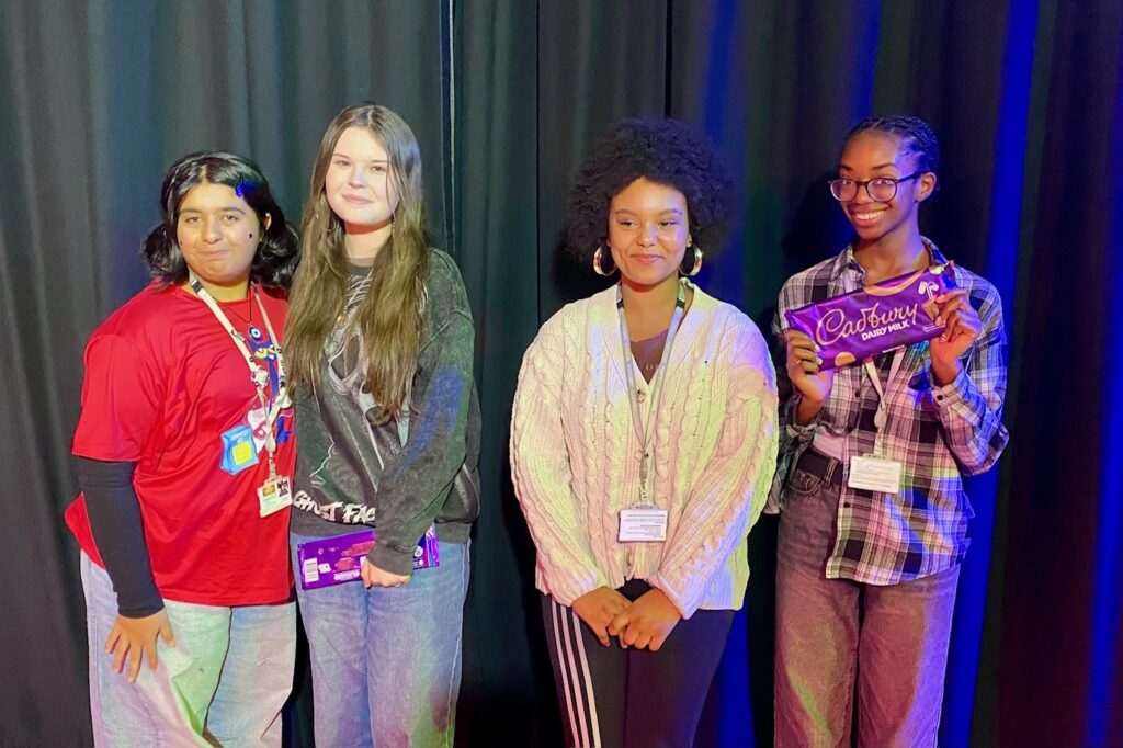 Four drama students waiting in the wings