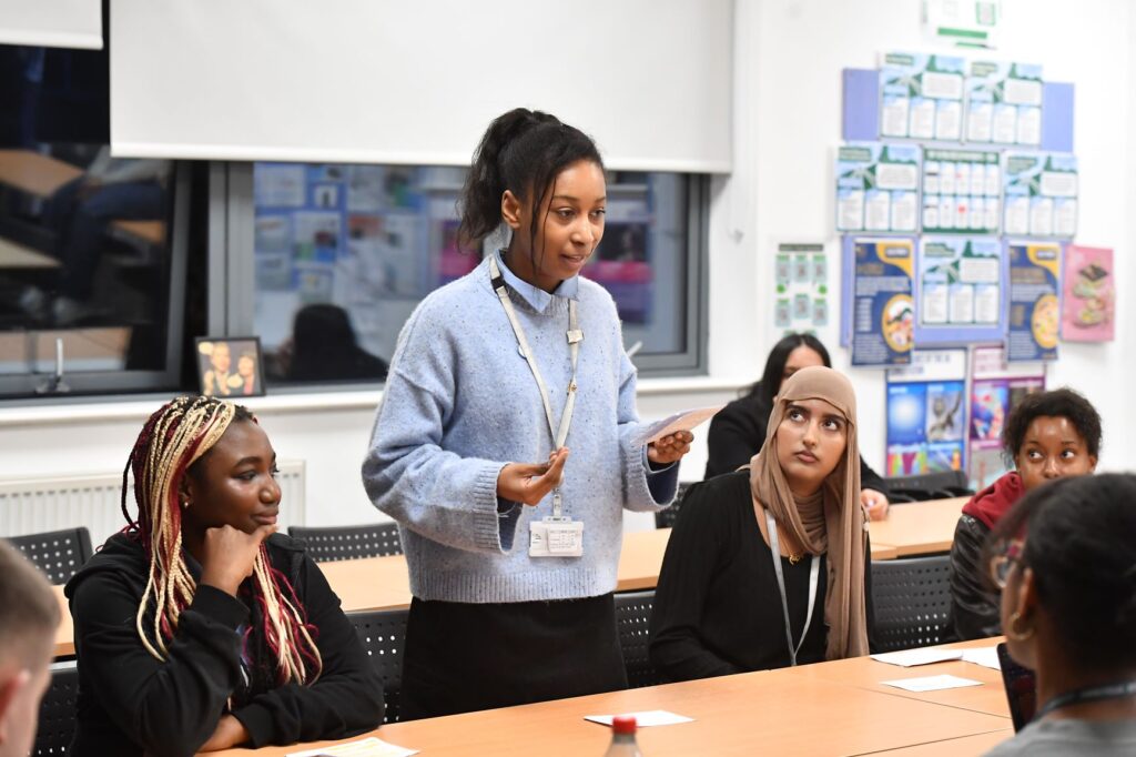 Student standing up to speak during class debate