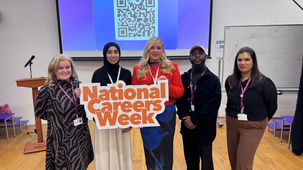 Staff and solicitors holding National Careers Week sign