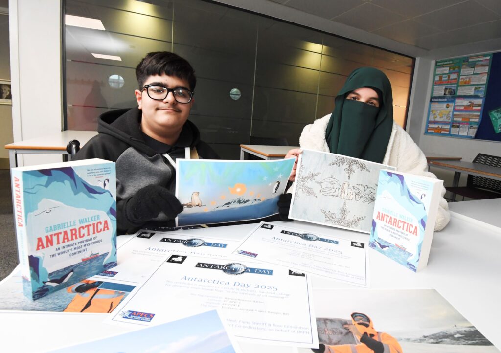 Geography students hold flag designs